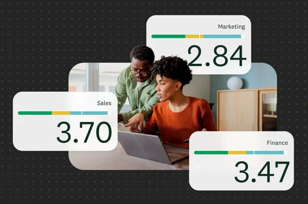 Colleagues looking at employee experience metric cards floating over a office workspace background